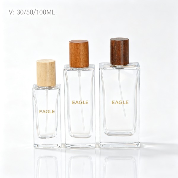 <bdi>45 ml</bdi> cylindrical amber glass perfume bottle مع mist sprayer & collar — wholesale glass packaging from Eaglebottle China factory