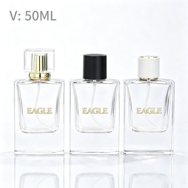 <bdi>45 ml</bdi> cylindrical clear glass perfume bottle atomizer bottle مع decorative cap — wholesale glass packaging from Eaglebottle China factory