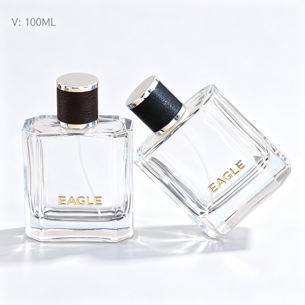 <bdi>45 ml</bdi> cylindrical clear glass perfume bottle مع fine-mist atomizer — wholesale glass packaging from Eaglebottle China factory