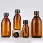 លក់ដុំតាមតម្រូវការ 200ml 250ml 300ml 500ml Amber Round Empty Lean Cough Syrup Bottle With Plastic Cap | ដបឥន្ទ្រី