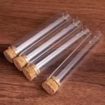 Engros Engros 10 ml borosilikatglas reagensglas hætteglas Korkprop Brugerdefineret 30 ml 40 ml 50 ml 60 ml 80 ml 100 ml klart rørformet hætteglas | Ørneflaske