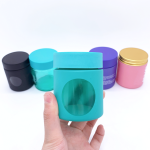 Venda a l'engròs de 3 oz de disseny de colors personalitzats Envàs a prova d'olors de flors amb finestra Pot de vidre hermètic a prova de nens amb tapa resistent a nens | Botella d'àguila