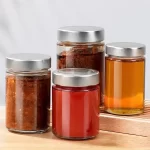 Grosir 106 212 314Ml Toples Ergo Kaca Sisi Lurus dengan Sumbat Logam Tinggi Berbagai Bentuk Bulat Botol Acar Kaca Kosong Penyimpanan Kemasan Makanan untuk Penggunaan Industri | botol elang