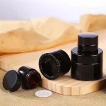 د عمده پلور ګمرک مینی 10ml 15ml 30ml امبر پاک نیلي تور شیشې لپ بام کانټینر د کاسمیټیک کریم جار 5g 0.5oz د پوستکي پاملرنې جار د لندبل سره | عقاب بوتل